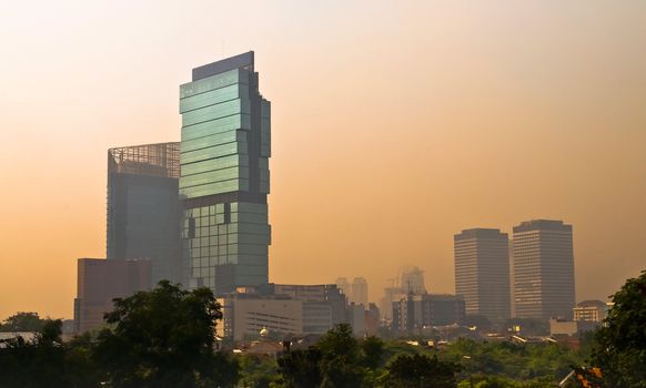 Jakarta Skyscraper skyline at dusk in orange light