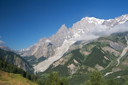 summer view of Veny Valley and mont Blanc from Ferret valley, Courmayeur, Italy. Photo taken with polarized filter