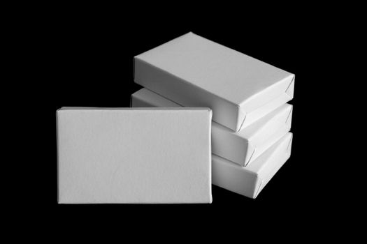White carton boxes isolated on black background