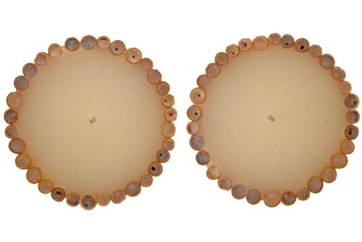 Top view of two decorated wax candle isolated on white background.