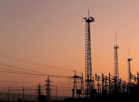 Sunset structures of electrical transmission towers.