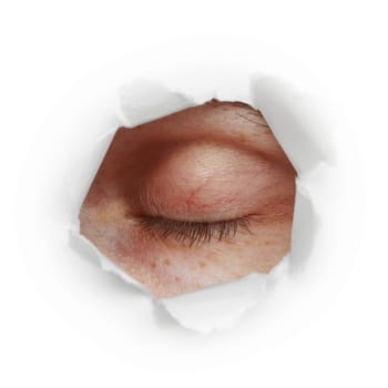 Closed human eye in a paper hole