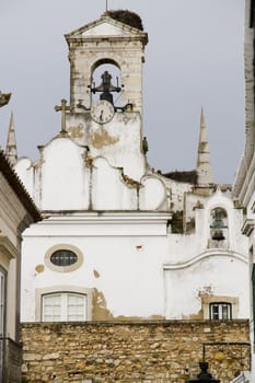 Section view of the bell tower from the arched entrance to the historical area of Faro, Portugal.