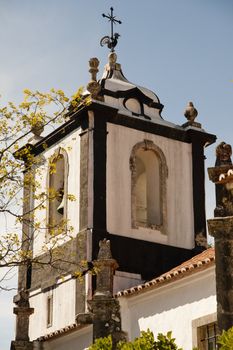 View of the top section of most churches, that include a bell tower.