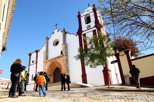 Many tourists photograph the church at Silves on Portugal.