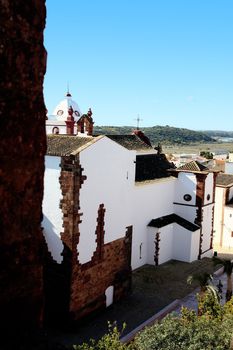 Castle view of the church of Silves, Portugal and surrounding village and hills.