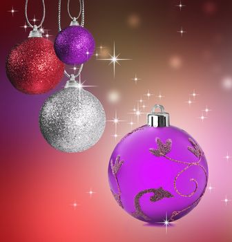 Colorful pink silver and red christmas baubles balls with colorful background