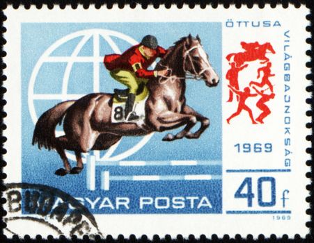 HUNGARY - CIRCA 1969: A stamp printed in Hungary shows horse jumping show, circa 1969