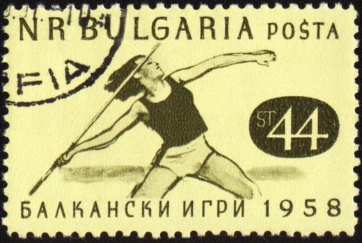 BULGARIA - CIRCA 1958: A post stamp printed in Bulgaria shows javelin throwing, devoted to Balkan games, circa 1958