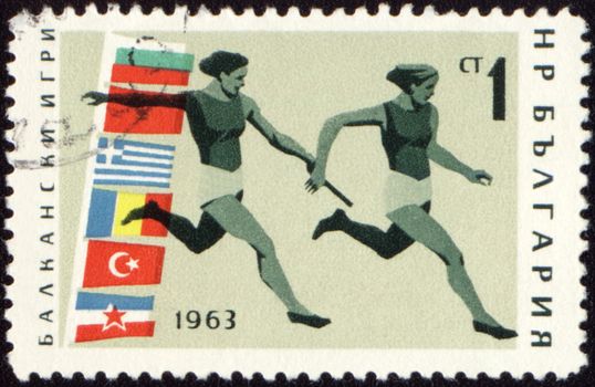 BULGARIA - CIRCA 1963: A post stamp printed in Bulgaria shows relay race, devoted to Balkan games, series, circa 1963