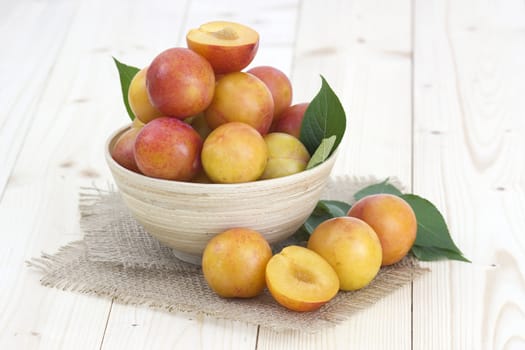 Fresh ripe plums in the bowl 