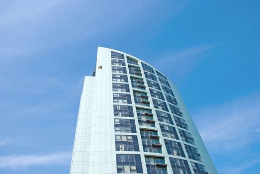 A White Modern Apartment Block under a blue sky