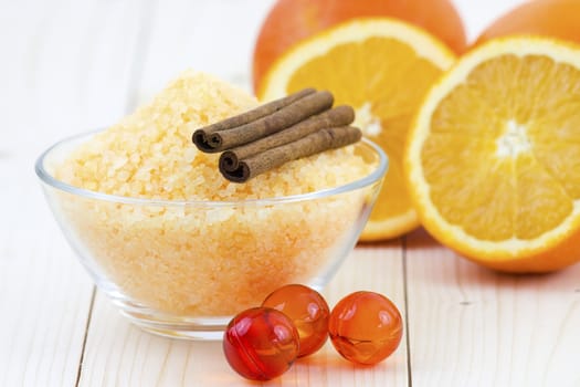 bowl of orange bath salt with fresh fruits - beauty treatment