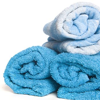 three blue towels on a white background