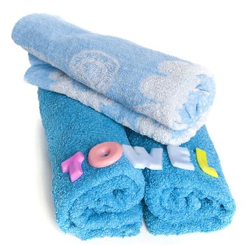 a blue towel and soapletters spelling "towel"