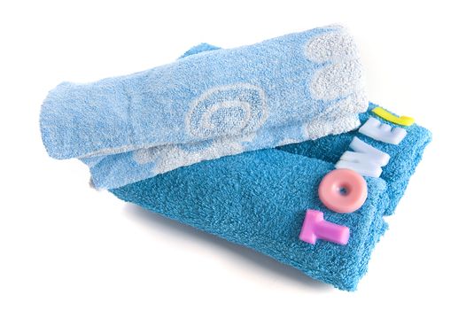 a blue towel and soapletters spelling "towel"