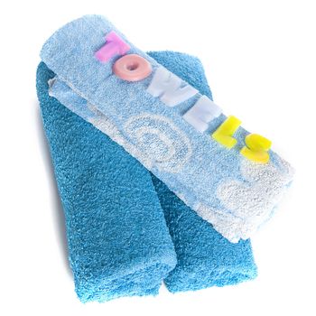 a blue towel and soapletters spelling "towels"