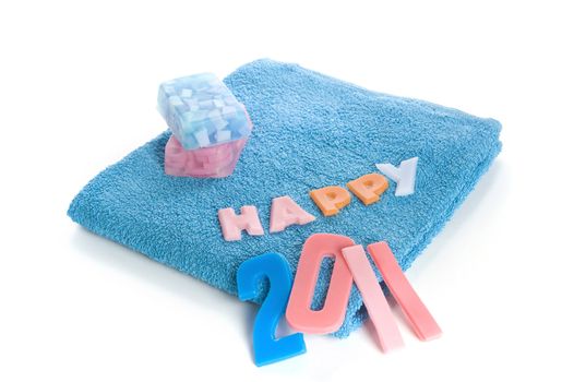 a blue towel and soapletters spelling "happy 2010"