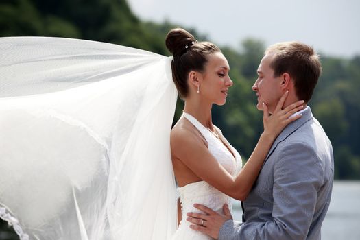 Newly-married couple in park