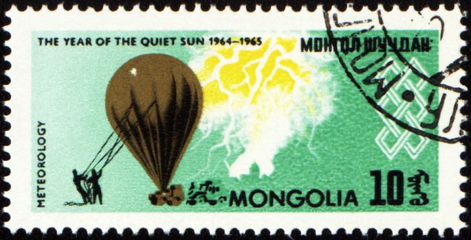 MONGOLIA - CIRCA 1965: stamp printed in Mongolia, shows meteorological balloon, series "The year of quiet Sun", circa 1965