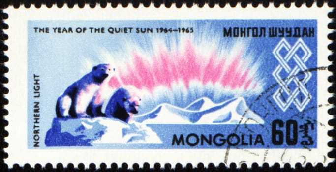 MONGOLIA - CIRCA 1965: stamp printed in Mongolia, shows polar bears and iceberg, devoted to the study of Northern Light, series "The year of quiet Sun", circa 1965