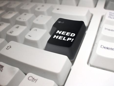 black enter key on a white keyboard with the following phrase: "Need Help!"