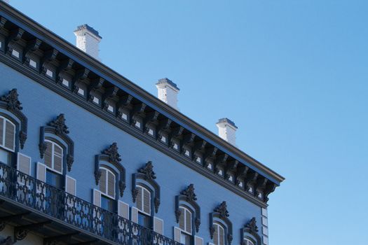 1800s gold country blue ornate building face with blue sky