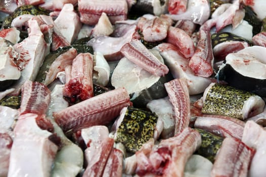Pile of flesh stripped and sliced pieces of cat shark at the market.