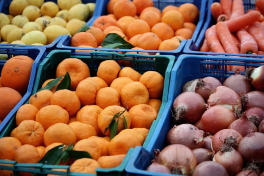 View of several boxes full of fruit and vegetables on a street market.