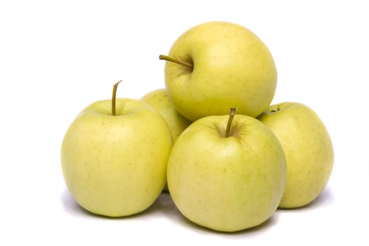 Close view of a bunch of yellow ginger gold variety type apples isolated on a white background.
