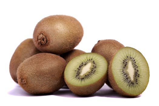 close view of a bunch of kiwi fruit isolated on a white background.