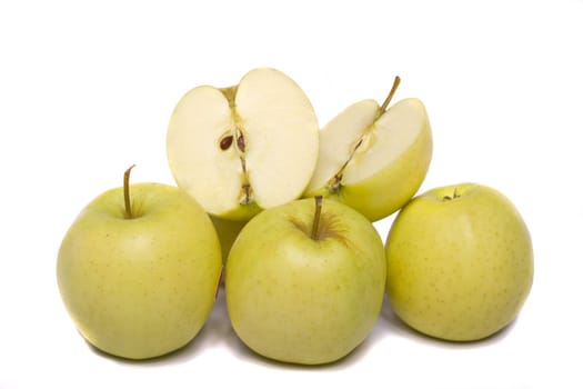 Close view of a bunch of yellow ginger gold variety type apples isolated on a white background.