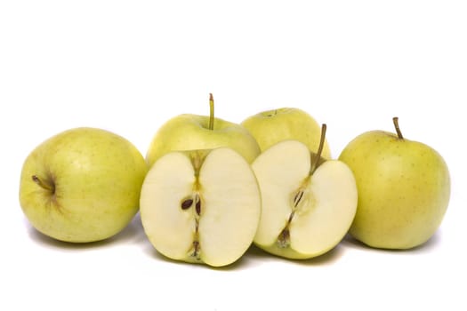 Close view of a bunch of yellow ginger gold variety type apples isolated on a white background.