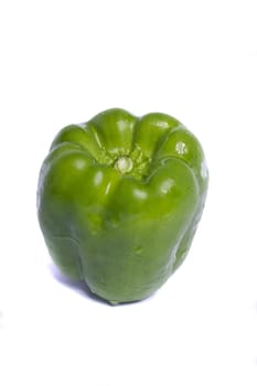 Close view of a green bell pepper isolated on a white background.