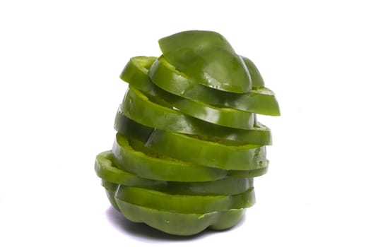 Close view of a green bell pepper isolated on a white background.