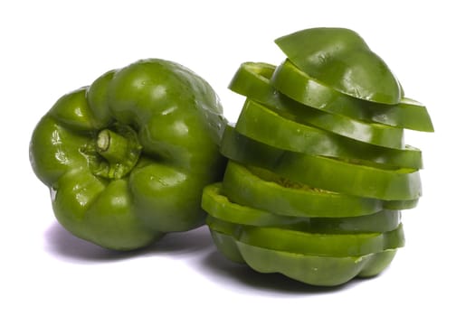 Close view of a green bell pepper isolated on a white background.