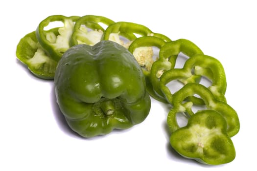 Close view of a green bell pepper isolated on a white background.