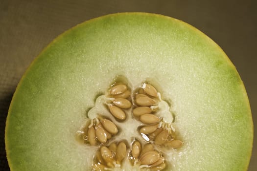 Closeup view of a sliced in half yellow melon.