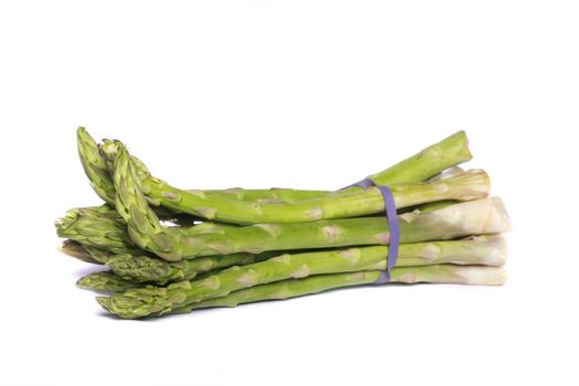 Close up view of a bunch of asparagus vegetable isolated on a white background.