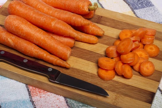 Close up view of a bunch of carrots isolated on a white background.