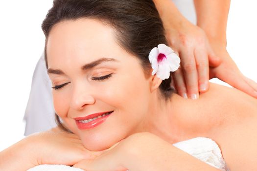 Closeup of a beautiful young woman  enjoying a massage.