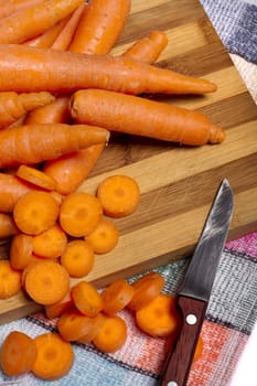 Close up view of a bunch of carrots isolated on a white background.