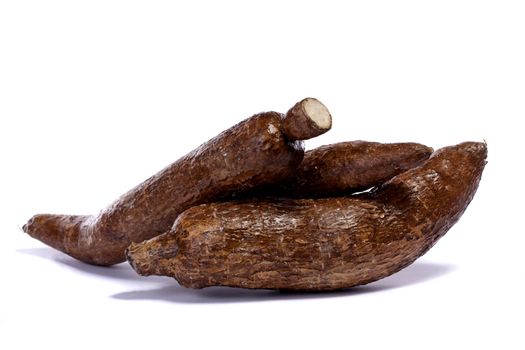 Close up view of the cassava root isolated on a white background.