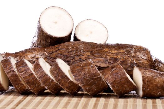 Close up view of the cassava root isolated on a white background.