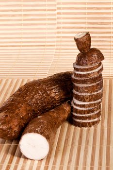 Close up view of the cassava root isolated on a white background.