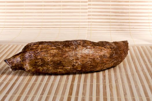 Close up view of the cassava root isolated on a white background.