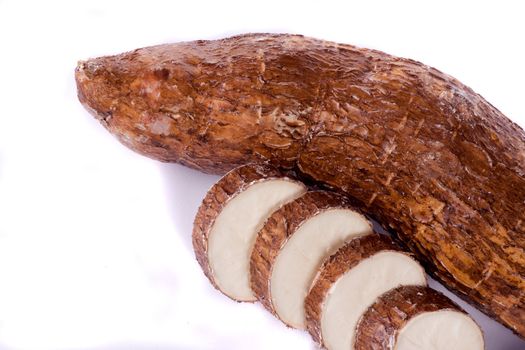 Close up view of the cassava root isolated on a white background.