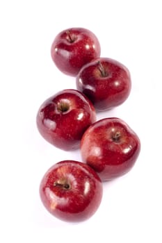 Close up view of some red apples isolated on a white background.