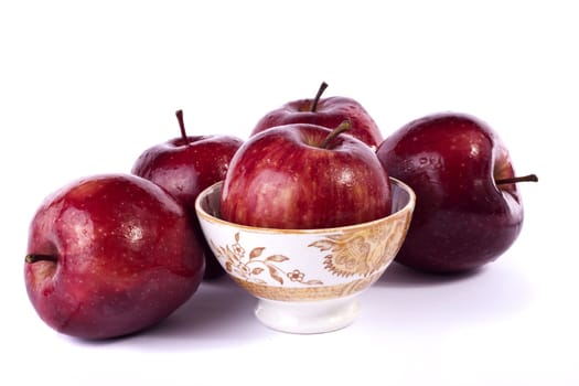 Close up view of some red apples isolated on a white background.