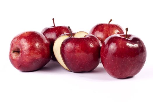 Close up view of some red apples isolated on a white background.